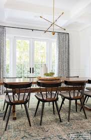 A cool, simple color palette is all this dining room needs to be completely stylish. Simple Minimal Dining Room Dining Room Small Vintage Dining Table Modern Dining Room