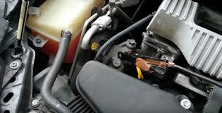 Use the pen/pointy object to remove the two mounting points. Toyota Prius Toyota Prius Battery Jump Start