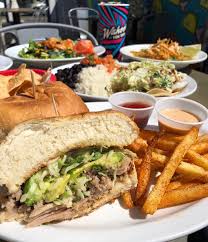 $8.95 four slices of seasoned fried green tomatoes, topped with blackened shrimp and peach chutney. Our Shredder Sandwich Is Loaded With Wahoo S Fish Taco Facebook
