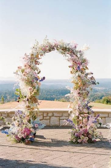 Stunning Colorful Wedding Ceremony Arch With Pastel Blue, Lavender, Blush, Coral Flowers