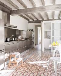 An open concept kitchen overlooks the pool area. Kitchen Floor Tile Ideas Houzz