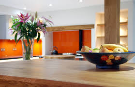 Try our granite worktop offcuts. Handleless Grey Quartz Worktops And Solid Oak Detail Uckfield
