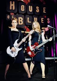 This is a still photograph of haley hudson who plays peg, the rhythm guitarist in the band pink slip. Freaky Friday 2003 Reeling Reviews