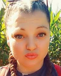 Karen Edwards is charged with second-degree assault, first-degree identity  theft and third-degree grand larceny.