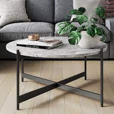 See the detailed photo here. Piper White Faux Marble Black Metal Frame Round Modern Living Room Coffee Table Nathan James