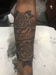 The leaves and the name tag are monochrome. Rose Clock Ribbon Name Tattoo For Mom Name Tattoos For Moms Rose Tattoos For Men Mom Tattoos