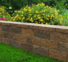 Dig a level trench that is 3 in. 8 X 18 Clifton Wall Straight Retaining Wall Block At Menards