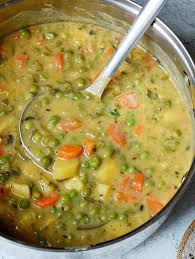 Good for body and soul! This Hearty Veggie Stew Contains Green Peas Potatoes Carrots And Other Healthy Vegetables The Vegan P Veggie Stew Recipes Vegan Dinner Recipes Stew Recipes