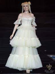 فستان من التول الفرنسي منفوش باللون الأصفر الباهت كورسيه مع عدد من القصات بوتيك غاليا الفهد دبي dress collection victorian dress dresses