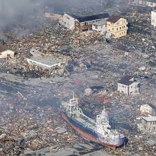Stretching into the distance, waves caused by the tsunami pour over the coastline and rush inland swamping all before them. Tsunami Katastrophe In Japan Flutwelle Loscht Kustenstadt Aus Der Spiegel