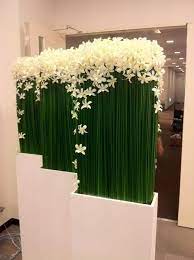 Dendrobium Orchids And Steel Grass Flower Arrangements Modern Flower Arrangements Hotel Flowers