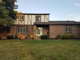 70s Tudor Wannabe What To Do With This Exterior I Am Thinking Paint Whole House Off White Cross Beams And Trim Greige Keep Mohegan House Styles House Beams