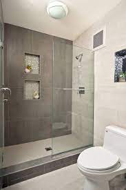 The shower cabin is surrounded with gray tiles from one side and a. Modern Walk In Showers Small Bathroom Designs With Walk In Shower Bathroom Design Small Small Bathroom Bathrooms Remodel