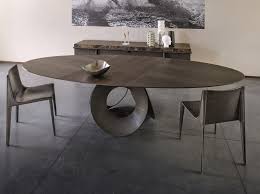 An oval dining table combines the linear simplicity of a rectangular top with the intimacy and comfort of a round one. Oracle Oval Table By Arketipo Design Gino Carollo