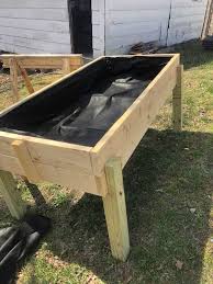 How To Build An Elevated Garden Bed Our Land And Home Gardening Beds How To In 2020 Elevated Garden Beds Building A Raised Garden Raised Garden Beds Diy Vegetables