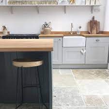 These are paired with minimalist metal handles. Prime Oak Worktops A Belfast Sink And Limestone Tiles What Is There Not To Love About This Contemporary Farmhouse Kitchen Oak Oakworktops Belfastsink Kok