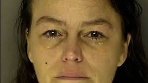 Police: Woman charged after holding knife to baby's throat