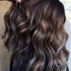 Blonde streaks are achieved with the help of aluminum foils and a brush. 3