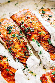 It's healthy, low calorie, and only uses a handful of ingredients! Pan Seared Salmon Recipe With Lemon Garlic Cream Sauce
