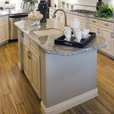 Check spelling or type a new query. Antique White Kitchen With Wood Floors And An Island Sink Kitchen Island With Sink Kitchen Island With Sink And Dishwasher Small Kitchen Island