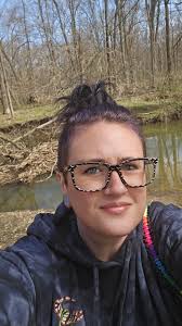 Adding red beads for eyes to the spider's body