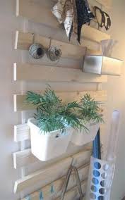 Whitewashed Lattenrost Hack With Hooks And Planters Attached To It For An Entryway Ikea Bed Frames Ikea Bed Ikea Hack