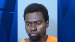 Family turns in man accused of brutally beating Phoenix phone store employee