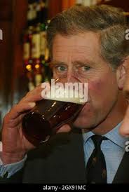 Prince Charles samples a pint of beer during his visit to the village of  Poundbury in Dorset. The Prince officially opened the Poet Laureate pub,  the first public house in Poundbury, and met local school children from  Bovington School who will plant trees in ...