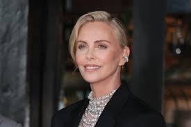 Charlize Theron Glowed Like a Goddess in a Bejeweled Sheer Dress and  Knee-High Gladiator Sandals