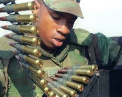 Lance Corporal Barrence Anthony of 2d LAAD BN, Bravo Bt, 2d Plt prepares 50  caliber rounds to be used during FIREX 3-99 at Onslow beach firing range,  MCB Camp Lejeune, NC. The