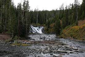 There is a small parking area and a sign alerting you to the falls. Artists Paint Pots Trail Lewis Falls Yellowstone