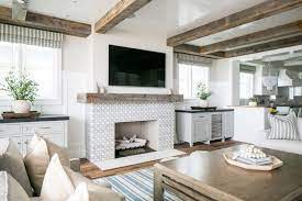 The striking seashell fireplace surround showcased here is artfully arranged with painstaking attention to detail. Awesome Fireplaces Within Beach Houses And Cottages Beach Bliss Living