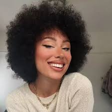 Mixed-race woman finally embraces curly locks