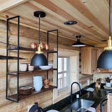 The wood shelves against the white planked walls and the marble run transparent glass shelves across a window and fill them with beautiful objects that will catch the light. Monty 1 Bracket Suspended Ceiling Mounted Shelf Bracket 1 Bracket Wood Shelves Shelves Industrial Kitchen Shelves