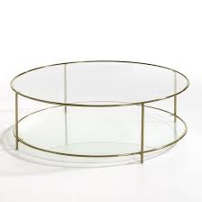 Glass tables make beautiful accent pieces, but they're also durable enough to be functional. Sybil Tempered Glass Round Coffee Table Round Glass Coffee Table Coffee Table Brass Coffee Table