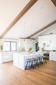 However, this all depends on the right lighting. White Vintage Barn Lights Over Kitchen Island Transitional Kitchen