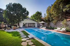 The homeowners of this house took advantage of their garage's location behind their house and added a deck above it that connects to the house. Want A Garage Pool House Combo Learn More Here And Try These Ideas Garage Guides
