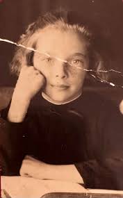 Our much loved Mum loved this photo of herself, she's in the middle at the  back. We lost her last week at just 66 😢 Could anyone get rid of the crease