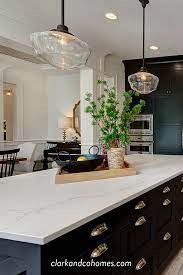 Black Custom Cabinets Contrast With The White Quartz Countertops In A Marble White Marble Countertops White Cabinets White Countertops White Quartz Countertop
