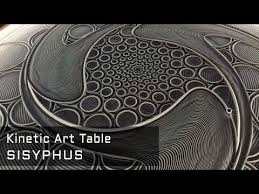 A Metal Ball Rolls Silently Through Sand Forever Creating And Erasing Beautiful Patterns Sisyphus Is A Kinetic Sculpture T Kinetic Art Sand Drawing Art Table