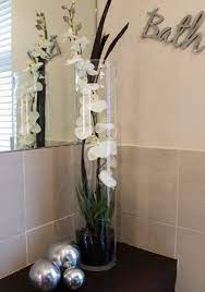 Artificial flower arrangement peacock feathers mirror vase flower arrangements this beautiful peacock floral arrangement has been the solution? 40 Beautiful Creative Diy Best Flowers Arrangement Ideas Bathroom Flowers Flower Arrangements Fake Flower Arrangements