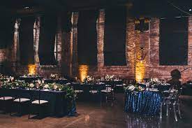 navy manhattan and navy giselle sequin paired with the mahogany resin chiavari chairs at the garden theater in detroit wedding rentals theatre wedding chiavari