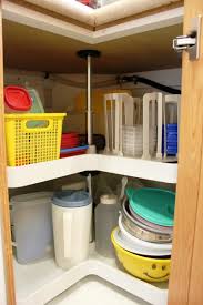 Slide the tip of a phillips screwdriver through the hole. Organizing Lazy Susans
