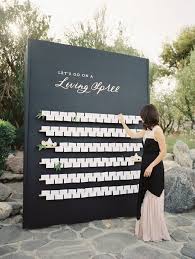 Picture Of A Black Seating Chart With Some Calligraphy And