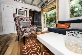 Urban Micro Home By Wind River Tiny Homes Glass Garage Door By Chattanooga Garage Door Sofa And Coffee Table Tiny House Interior Micro House Diy Tiny House