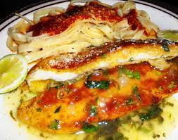 A light parmesan cheese crusted fish. Orange Roughy With Lemon Sauce Orange Roughy Recipes Orange Recipes Shellfish Recipes
