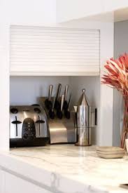 cute roller door to hide mess kitchen