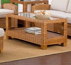 A rattan table that features a glass layer at the top. Millennial Rectangular Rattan Cocktail Table Custom Finishes