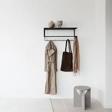 Find the best designs for 2020! Curved Pouf Poufs Are In Themselves A Graphic Element Built Up Around Simple Principles The Curved Pouf Is Made Of In 2020 Black Coat Hanger Coat Hanger Rack Design