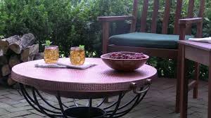 The poker matches the metal base in a. Solid Hammered Copper Fire Pit With Lid Converts To Table Sku 35116 Plow Hearth Youtube